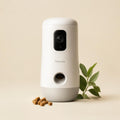 White pet camera with treat dispenser